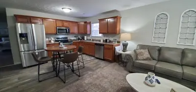 a kitchen and living room with a couch and a table at Diamonds are Forever-700 in Middletown