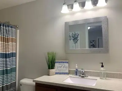 a bathroom with a sink and a mirror at Diamonds are Forever-700 in Middletown