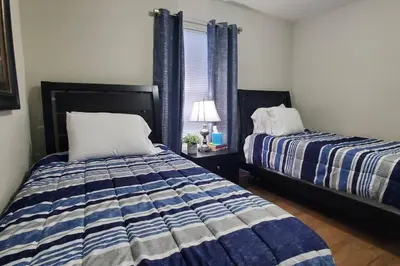 a bedroom with two beds and a window at Diamond in the Sky-704 in Middletown