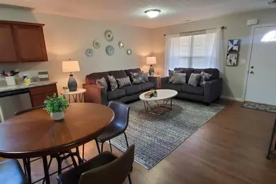 a living room with a couch and a table at Diamond in the Sky-704 in Middletown