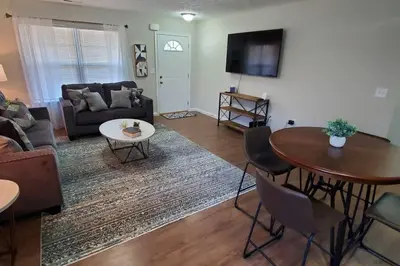 a living room with a couch and a table at Diamond in the Sky-704 in Middletown