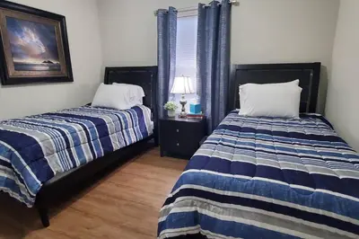 a bedroom with two beds and a window at Diamond in the Sky-704 in Middletown