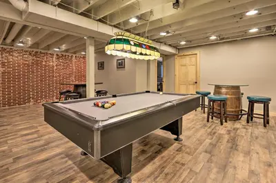 a billiard room with a pool table and chairs at Luxe Dog-Friendly Cabin with Hot Tub and Game Room in Logan