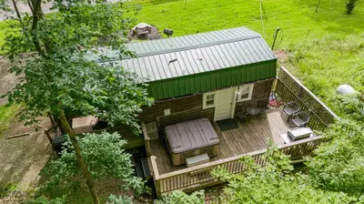 an overhead view of a house with a deck at Acorn Cottage at Hocking Vacations in Logan