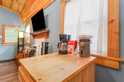a kitchen with a wooden counter top with a blender at Acorn Cottage at Hocking Vacations in Logan