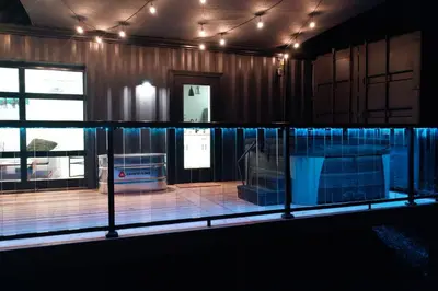 a view of a room with a stage at The Hideaway on Tacketts - Shipping Container in Hurricane