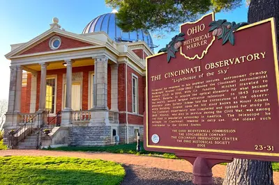 a building with a sign in front of it at Cozy Cottage in the Heart of Hyde Park home in Cincinnati