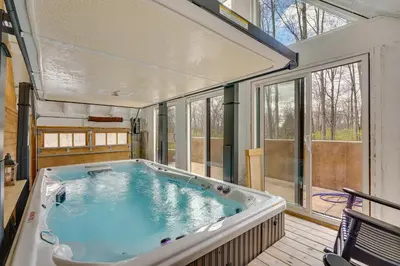 a large hot tub in a room with windows at Family Home Swim Spa, Patios, Grill and Fire Pit in Delaware