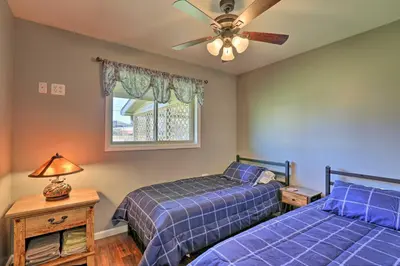a bedroom with two beds and a ceiling fan at Dayton Home with Patio and Fire Pit about 6 Mi Dtwn! in Dayton