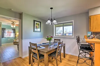 a dining room and kitchen with a table and chairs at Dayton Home with Patio and Fire Pit about 6 Mi Dtwn! in Dayton
