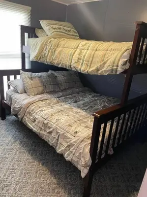 two bunk beds in a room with a bedemate at Sheppard's Holler in Parsley