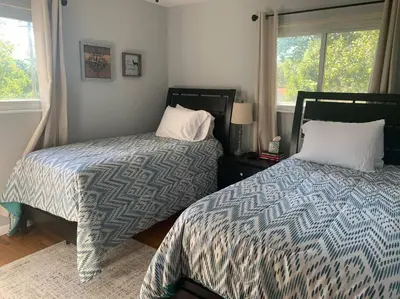 two beds sitting next to each other in a bedroom at Spacious Four Bedroom Attached Home in Springboro- Unit 1 in Springboro