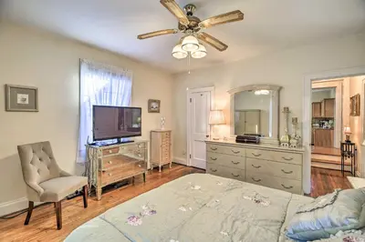 a bedroom with a bed and a flat screen tv at Half-Mi to Dawkins Rail Trail Family Home with Yard in Paintsville