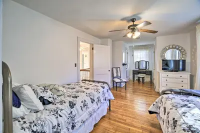 a bedroom with two beds and a ceiling fan at Half-Mi to Dawkins Rail Trail Family Home with Yard in Paintsville