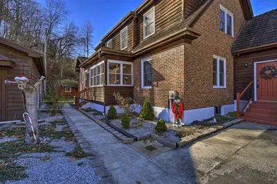 a house with a christmas display in front of it at Half-Mi to Dawkins Rail Trail Family Home with Yard in Paintsville