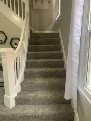 a staircase with grey carpet and white railings at 6 BR Home Just Minutes From Downtown Cincinnati in Cincinnati