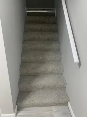 a staircase in a house with grey carpet at 6 BR Home Just Minutes From Downtown Cincinnati in Cincinnati