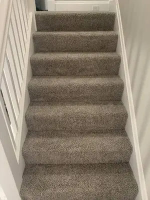 a staircase with grey carpeting in a house at 6 BR Home Just Minutes From Downtown Cincinnati in Cincinnati