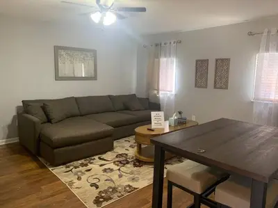 a living room with a couch and a table at Comfortable Two Bedroom on Royal in Springboro in Springboro