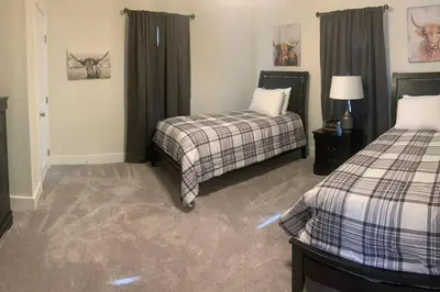 a hotel room with two beds in a room at Remodeled Farm House with Plenty of Charm in Monroe