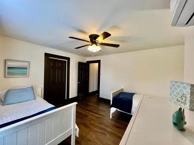 a bedroom with a bed and a ceiling fan at Newly Renovated Historic mansion ☆ 8 Bedrooms in Hamilton