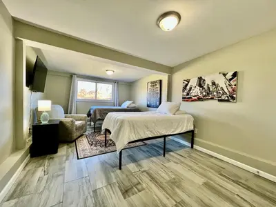 a bedroom with a bed and a living room at Charming 4BR Home in Liberty Township w Large Deck in Maustown