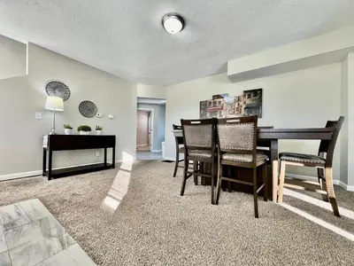 a living room with a dining room table and chairs at Charming 4BR Home in Liberty Township w Large Deck in Maustown