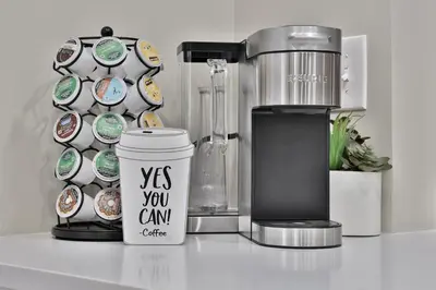 a coffee maker and a cup on a counter at *New* XquisiteMidCenturyM0d~ Condo *OTR* w/Parking in Cincinnati