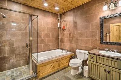 a bathroom with a tub and a toilet and a sink at Walhonding Woods Secluded Farmland Retreat! in Walhonding
