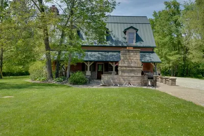 a house with a green roof and a lawn at Walhonding Woods Secluded Farmland Retreat! in Walhonding