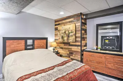 a bedroom with a large bed and a mirror at Zen Studio about 20 Min to Downtown Columbus! in Blacklick