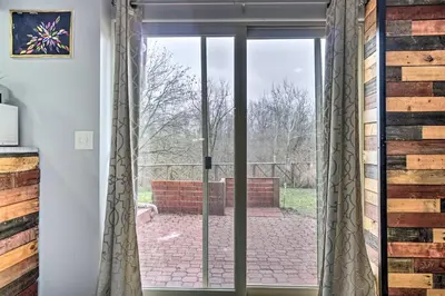 a sliding glass door leading to a patio at Zen Studio about 20 Min to Downtown Columbus! in Blacklick