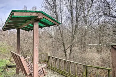 a wooden structure with a bench on a fence at Zen Studio about 20 Min to Downtown Columbus! in Blacklick
