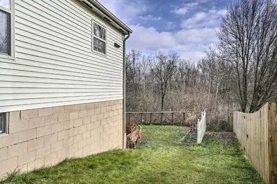 a yard next to a house with a fence at Zen Studio about 20 Min to Downtown Columbus! in Blacklick