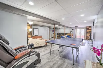 a living room with a ping pong table in it at Zen Studio about 20 Min to Downtown Columbus! in Blacklick