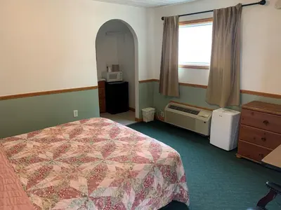 a hotel room with a bed and a window at HAVEN INN in Glendale