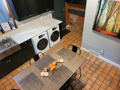 a kitchen with two tables with teddy bears on it at Spacious Industrial split level with a Balcony in Cincinnati