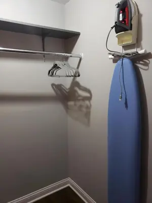 a room with a blue surfboard hanging on a wall at Modern style and comfort near UC in Cincinnati