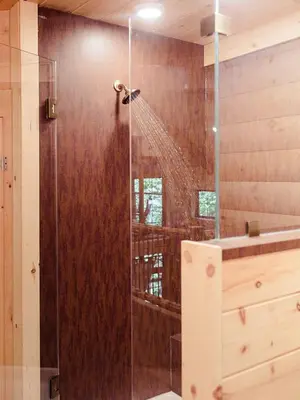 a shower in a bathroom with a shower at Treehouse #1 by Amish Country Lodging in Millersburg