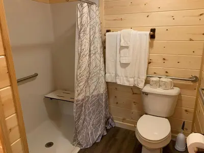 a bathroom with a toilet and a shower at Waterview Lodge by Amish Country Lodging in Millersburg