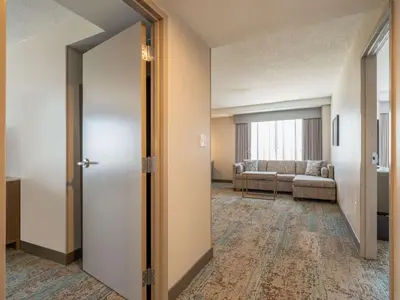 an open door to a living room with a couch at Homewood Suites By Hilton Toledo Downtown in Toledo