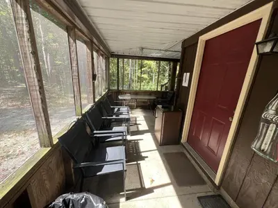 a row of benches sitting inside of a train at Rock Stalls Lodge in Logan