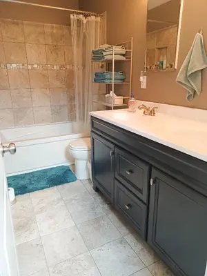 a bathroom with a sink and a tub and a toilet at Huge 2 Bedroom House in the Heart of Northside! in Cincinnati