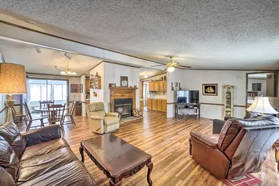 a living room with a couch and a table at Rustic Family Home and Acreage about 20 Mi Hocking Hills in Lancaster
