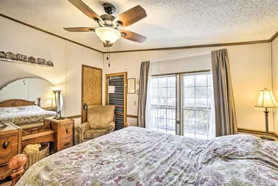 a bedroom with a bed and a ceiling fan at Rustic Family Home and Acreage about 20 Mi Hocking Hills in Lancaster