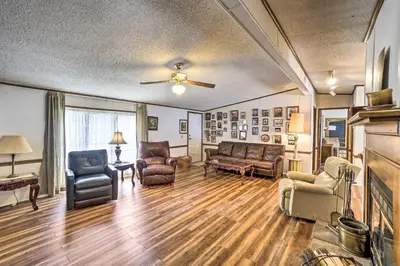 a living room with furniture and a ceiling fan at Rustic Family Home and Acreage about 20 Mi Hocking Hills in Lancaster