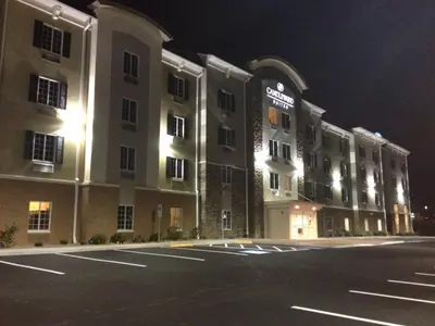 an empty parking lot in front of a hotel at night at Candlewood Suites Youngstown W - I-80 Niles Area by IHG in Austintown