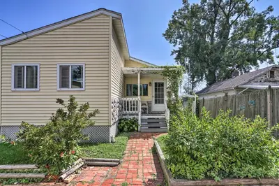 a house with a brick walkway in front of it at Lake Erie Waterfront Home with Sunroom and Yard! in Erie