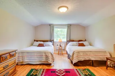 a bedroom with two beds and a window at Serene Mountain Retreat on 40 Acres with Fire Pit! in Bomont