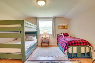 a bedroom with two bunk beds and a window at Serene Mountain Retreat on 40 Acres with Fire Pit! in Bomont